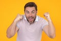 Man shouting. Portrait of Angry man screaming. Portrait of young shouting man isolated on yellow background. Shouting Royalty Free Stock Photo