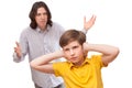 Man shouting at a small boy who is not listening