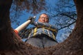 Man with a shovel stands by his hole in the garden