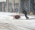 Man shoveling snow during snow storm