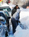 Man shovelling the aftermath of a winter blizzard Royalty Free Stock Photo