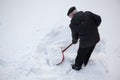 Man shovelling fresh snow
