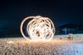 Man show spin fire on beach Royalty Free Stock Photo