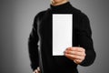 Man showing blank white flyer brochure booklet. Leaflet presenta Royalty Free Stock Photo