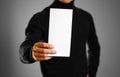 Man showing blank white flyer brochure booklet. Leaflet presenta Royalty Free Stock Photo