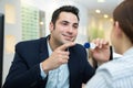 man showing contact lens to female customer Royalty Free Stock Photo