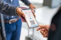 Man showing digital flight e-ticket to stewardess Royalty Free Stock Photo