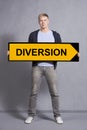 Man showing diversion sign. Royalty Free Stock Photo