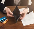 Man showing empty wallet without cash