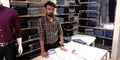 man showing formal shirt at showroom in India