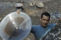 Man showing the gold he found in the river of Mariana, Brazil. Royalty Free Stock Photo