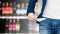 Man showing his empty pocket on blur alcohol. Royalty Free Stock Photo