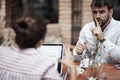 Man showing with his index finger on his mouth to a female to be quite Royalty Free Stock Photo