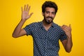 Man showing inviting gesture with hands, ask to join, beckoning to coming, gesturing hello goodbye