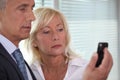Man showing mobile phone to woman Royalty Free Stock Photo