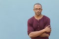 Man showing neutral expression closeup with arms crossed Royalty Free Stock Photo