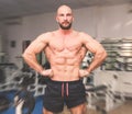 Man showing off his muscles after a hard workout at the fitness center Royalty Free Stock Photo