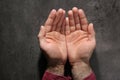 Man showing palms at table, top view. Royalty Free Stock Photo