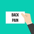 Man showing paper BACK PAIN text