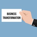 Man showing paper BUSINESS TRANSFORMATION text Royalty Free Stock Photo