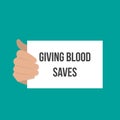 Man showing paper GIVING BLOOD SAVES