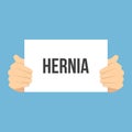 Man showing paper HERNIA text