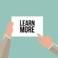 Man showing paper LEARN MORE text Royalty Free Stock Photo