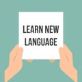 Man showing paper LEARN NEW LANGUAGE Royalty Free Stock Photo
