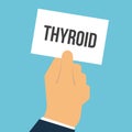 Man showing paper THYROID text