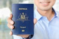 A man showing passport (of Australia)