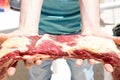 Man showing a piece of Argentine Asado Royalty Free Stock Photo