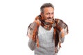 Man showing scarf around neck