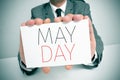 Man showing a signboard with the text may day Royalty Free Stock Photo