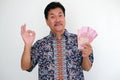 Man showing some cash money with happy expression Royalty Free Stock Photo