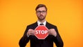 Man showing stop sign, voting against race and gender discrimination at work Royalty Free Stock Photo