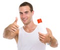 Man showing sun screen creme and thumbs up Royalty Free Stock Photo