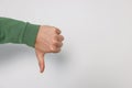 Man showing thumb down on white background, closeup. Space for text Royalty Free Stock Photo