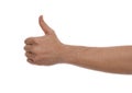 Man showing thumb up gesture against background, closeup of hand Royalty Free Stock Photo