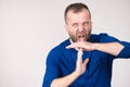 Man showing time stop gesture