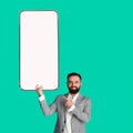 Man showing white empty smartphone screen, mockup Royalty Free Stock Photo