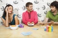 Man Showing Winning Hand To Friends While Playing Cards Royalty Free Stock Photo