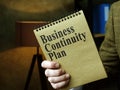 Man shows Business Continuity Plan BCP in the office.