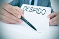 Man shows a document with the text despido, dismissal in spanish Royalty Free Stock Photo