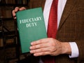 A man shows Fiduciary duty law book.