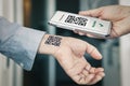 man shows his hand with a qr code, a confirmation of the vaccination against the covid 19 coronavirus. Temporary tattoo. Scan the