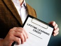 Man shows papers about Lifetime Learning Credit