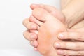 Man shows problem skin on the foot and sole of the foot dry and callous skin with mazols with a stem, close-up, copy space,