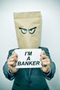 Man shows a signboard with the text I am a banker