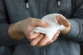 Man shows wounded arm rewound with white bandage Royalty Free Stock Photo