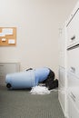 Man in shredded paper bin Royalty Free Stock Photo